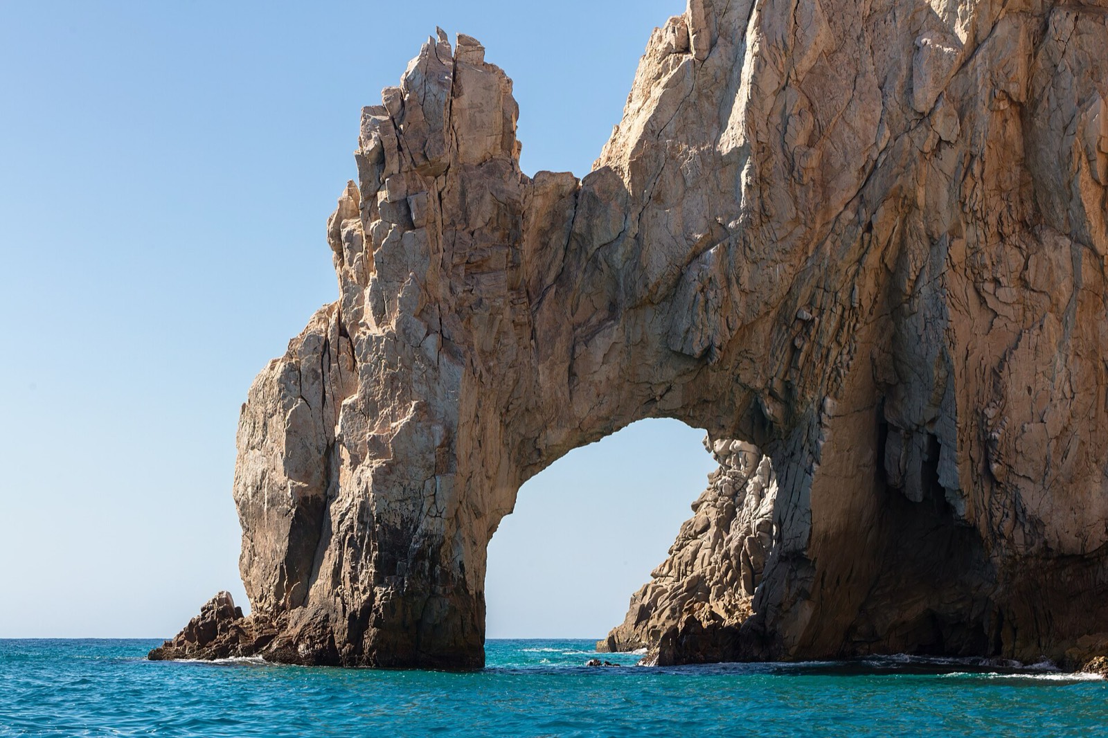 El Arco granite rock arch rising from turquoise water at Land's End in Cabo San Lucas