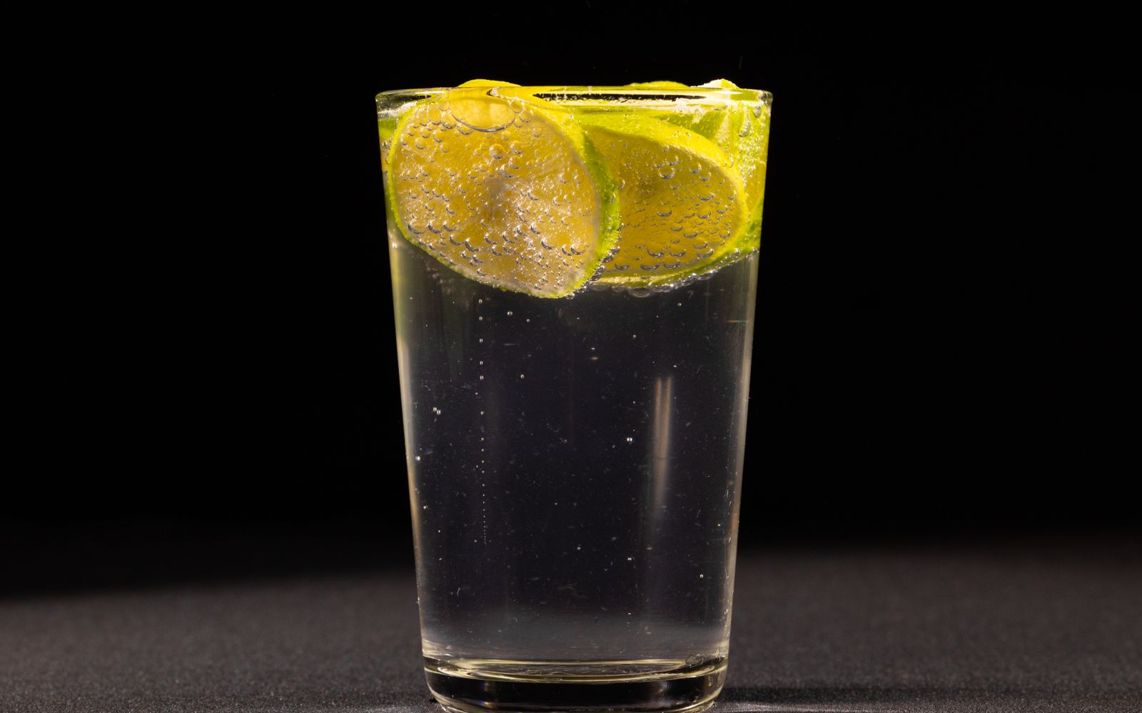 A refreshing drink with lime by the pool