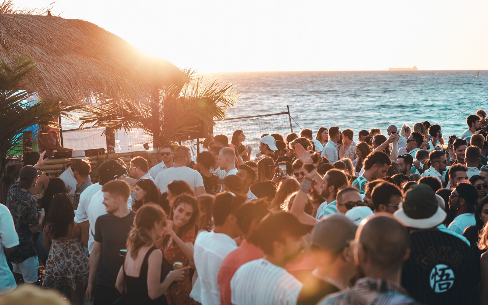 A lively beach party scene in Cabo