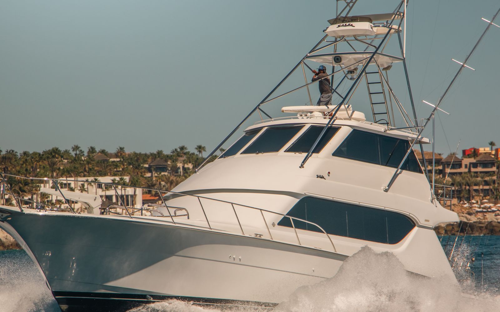 A sportfishing boat heading out at dawn